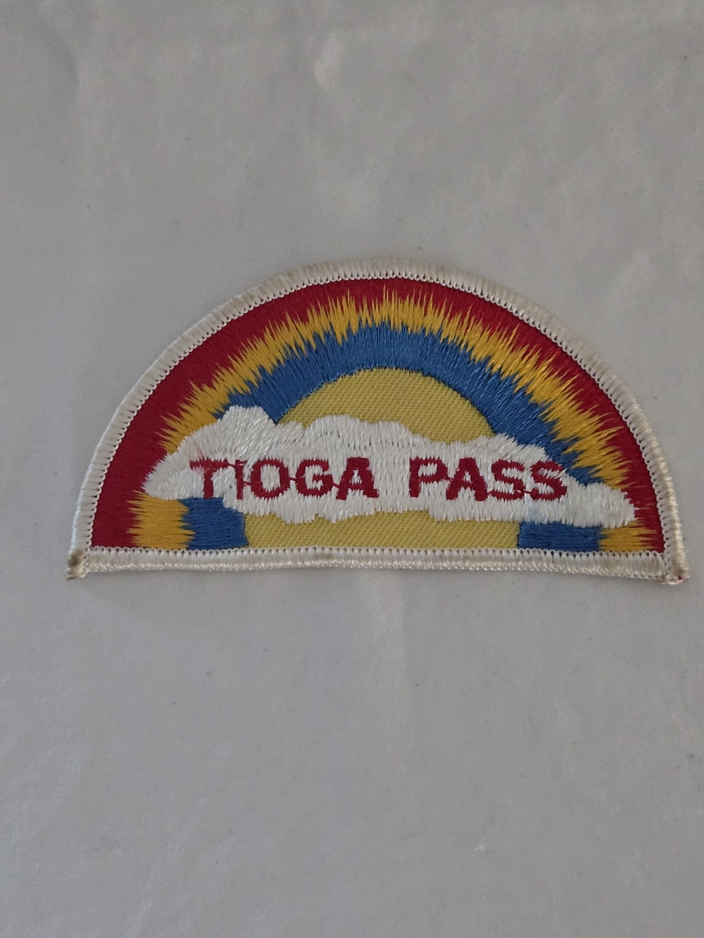 Vintage Tioga Pass Half-Moon Patch in Red, Yellow, Blue With White Clouds